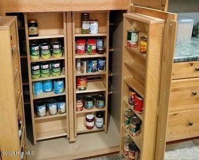 Enjoy one-level living with an abundance of extras in the