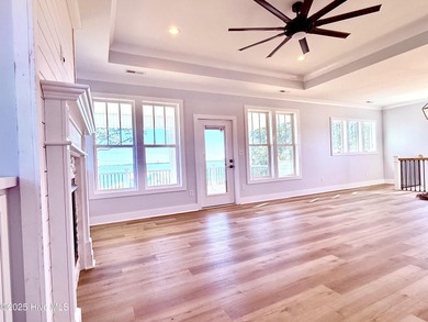 Experience elevated coastal living in this impeccably crafted