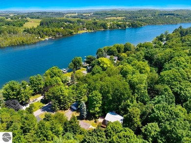 Nestled among mature hardwoods on a private wooded setting, this - photo 3