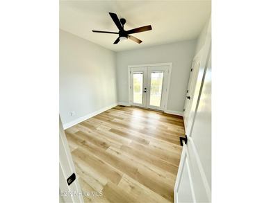 Experience elevated coastal living in this impeccably crafted