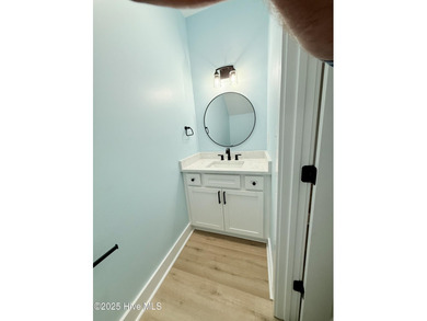 Experience elevated coastal living in this impeccably crafted