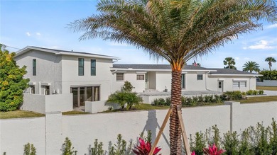 Set along an extraordinary 149 feet of water frontage, 102 E - photo 2