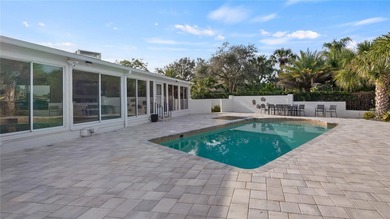 Set along an extraordinary 149 feet of water frontage, 102 E - photo 9