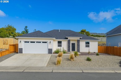 Experience modern coastal living in this custom-built 2023 home - photo 2