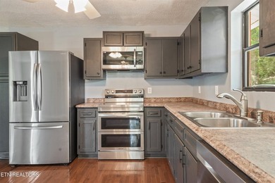 Welcome to this inviting basement ranch home nestled on a - photo 12