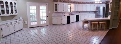Nestled on a beautifully wooded and landscaped double lot, this - photo 2