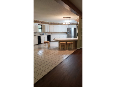 Nestled on a beautifully wooded and landscaped double lot, this - photo 3