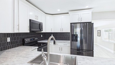 Welcome home to this beautifully remodeled 3BR/2BA residence - photo 8