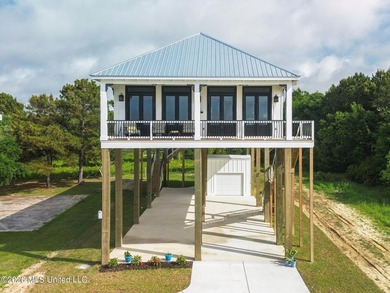 Experience effortless beachfront living in this stunning turnkey - photo 1