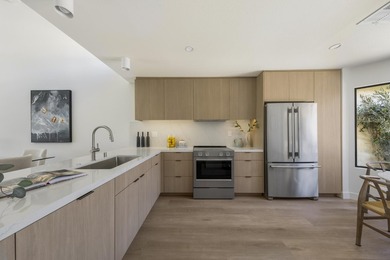 Framed by water, golf course, and mountain views, this fully - photo 2