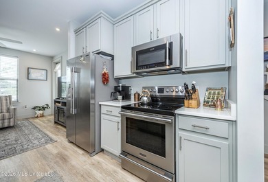 WELCOME HOME to easy coastal living in the highly sought after - photo 9