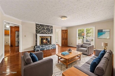 Welcome to this spacious 4-sided brick home with painted cedar