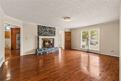 Welcome to this spacious 4-sided brick home with painted cedar