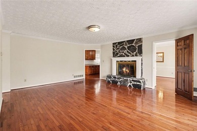 Welcome to this spacious 4-sided brick home with painted cedar