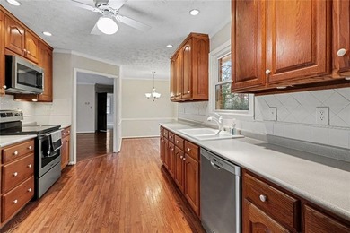 Welcome to this spacious 4-sided brick home with painted cedar