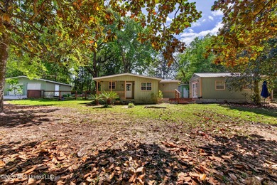 This home is tucked away on a 3 acre parcel. This charming 2 - photo 2