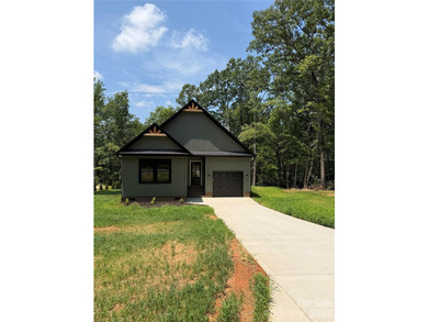 This new 1,240 sq. ft. bungalow features a clean, functional - photo 2