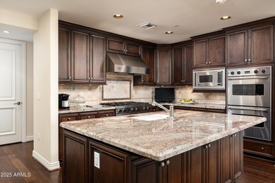 Anchored by an extraordinarily large 36-foot balcony, this