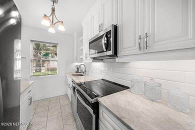 Riverfront living awaits in this beautifully updated condo in - photo 3