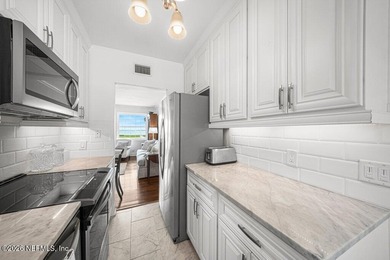 Riverfront living awaits in this beautifully updated condo in - photo 4