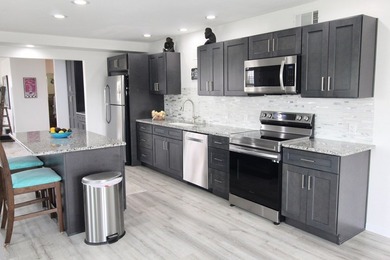 Escape to your own coastal paradise in this completely renovated - photo 25