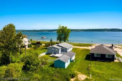 Nestled along the north shore of Portage Lake with 68 feet of - photo 1