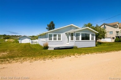 Nestled along the north shore of Portage Lake with 68 feet of - photo 2