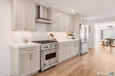 Discover exceptional coastal living in this beautifully rebuilt