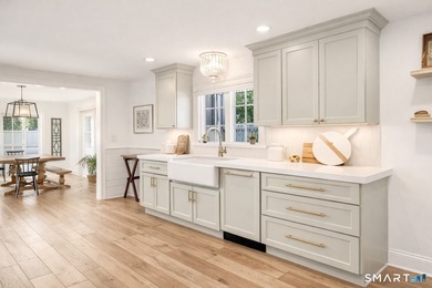 Discover exceptional coastal living in this beautifully rebuilt