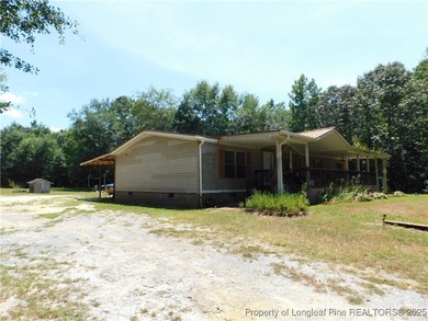 For Sale! This charming three-bedroom, two-bathroom home is
