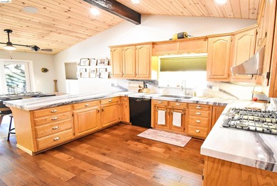 LAKEFRONT LIVING, WITH SWEEPING, PANORAMIC LAKE & MOUNTAIN - photo 12