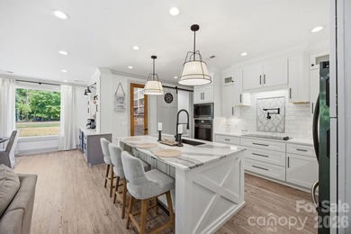 2023 build, sitting on 4.77 acres this 4BR, 3.5BA home blends - photo 13