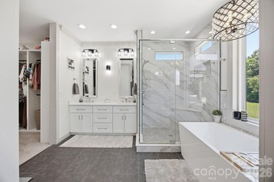 2023 build, sitting on 4.77 acres this 4BR, 3.5BA home blends - photo 21