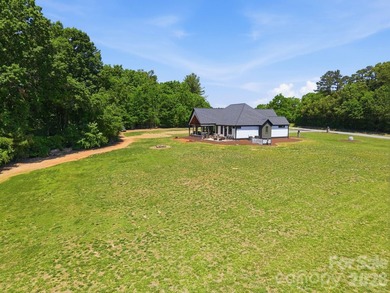 2023 build, sitting on 4.77 acres this 4BR, 3.5BA home blends - photo 45
