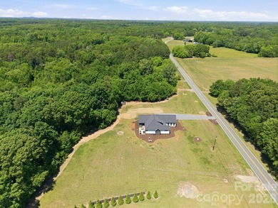 2023 build, sitting on 4.77 acres this 4BR, 3.5BA home blends - photo 47