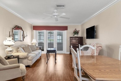 Welcome to this beautifully updated villa, featuring a spacious - photo 3
