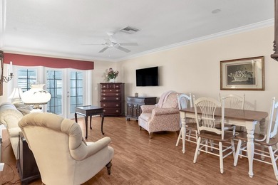 Welcome to this beautifully updated villa, featuring a spacious - photo 4
