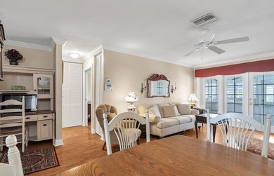 Welcome to this beautifully updated villa, featuring a spacious - photo 5