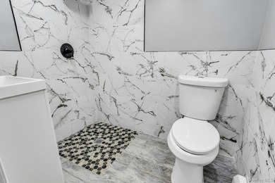 Welcome to 171-38 105 Avenue, a beautifully renovated two-family - photo 12