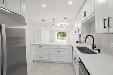 Stunning renovated downstairs 2/2 condo overlooking a beautiful - photo 1