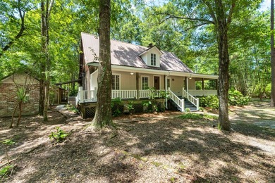 Hidden beneath towering hardwoods on a private wooded setting - photo 2