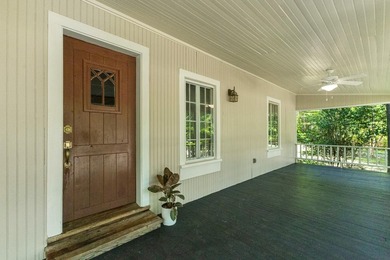 Hidden beneath towering hardwoods on a private wooded setting - photo 6