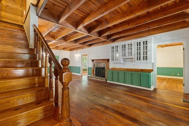 Hidden beneath towering hardwoods on a private wooded setting - photo 7