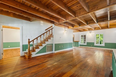 Hidden beneath towering hardwoods on a private wooded setting - photo 8