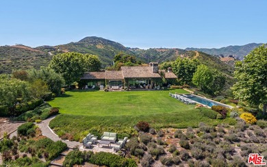 Tucked away behind gates atop the Malibu hills, this enchanting - photo 3