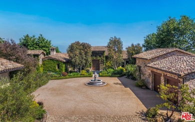 Tucked away behind gates atop the Malibu hills, this enchanting - photo 7