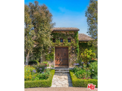 Tucked away behind gates atop the Malibu hills, this enchanting - photo 9