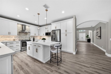 GORGEOUS LAKE FRONT HOME IN THE HIGHLY DESIRABLE GATED COMMUNITY - photo 16