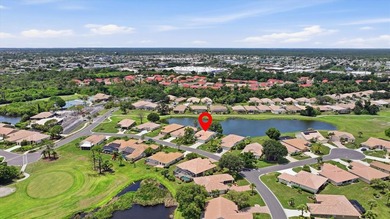 Panoramic pond and 10th fairway views, soaring ceilings, and - photo 4