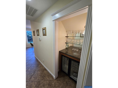 Exquisite home features vaulted ceilings & arched windows